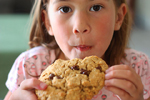 A girl eating a cookie